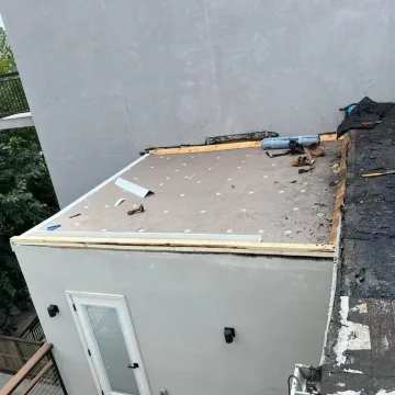 damaged roofing on the house at elliot place