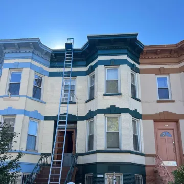 ladder going up the house for roofing